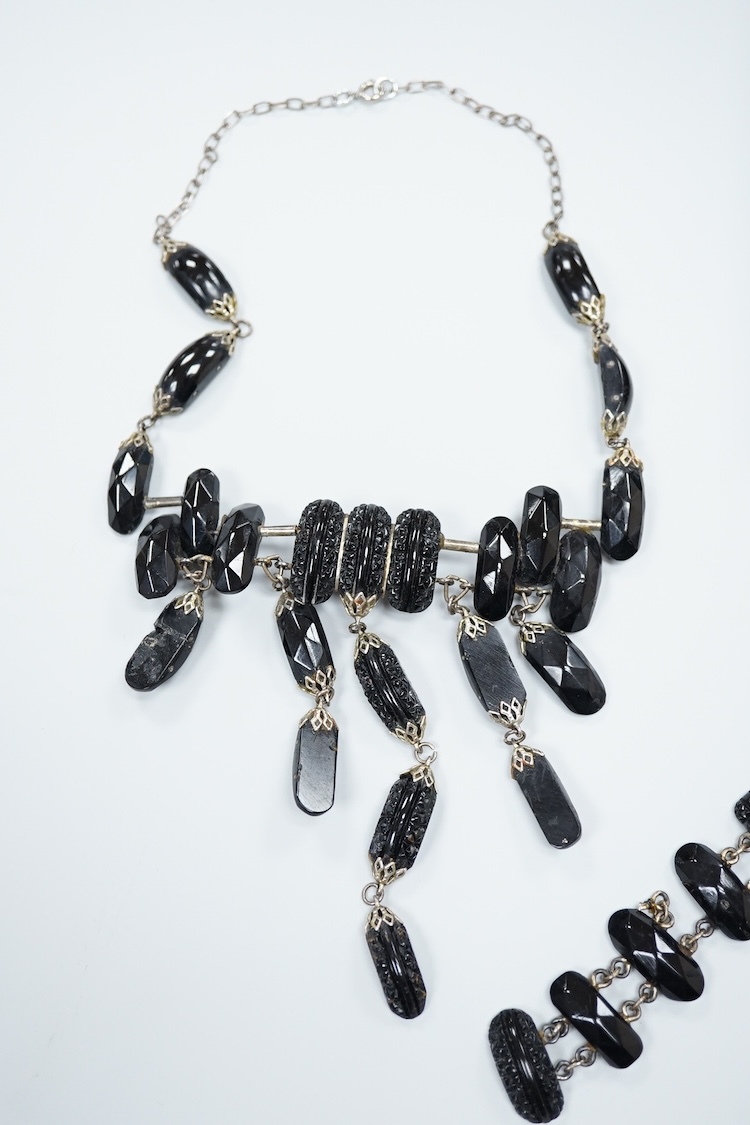 A small group of assorted Whitby jet jewellery including a matching bracelet and necklace, etc.